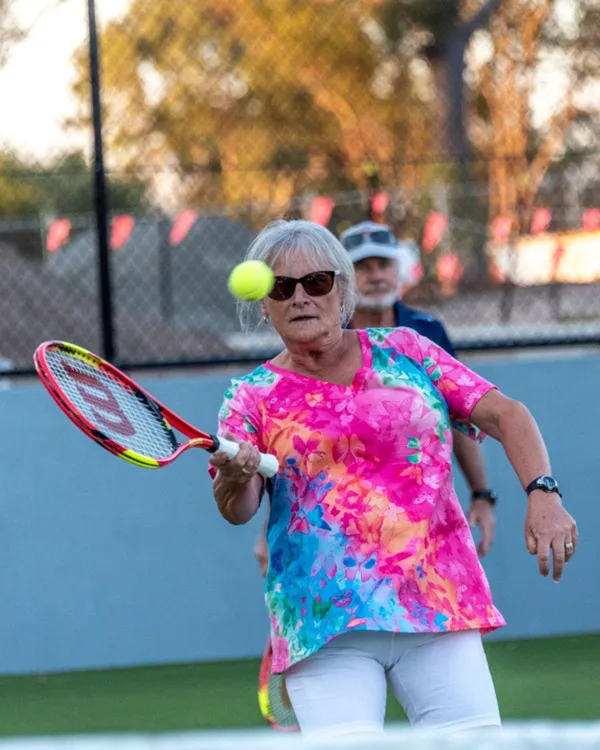 Good Life Residents celebrate with a game of Tennis